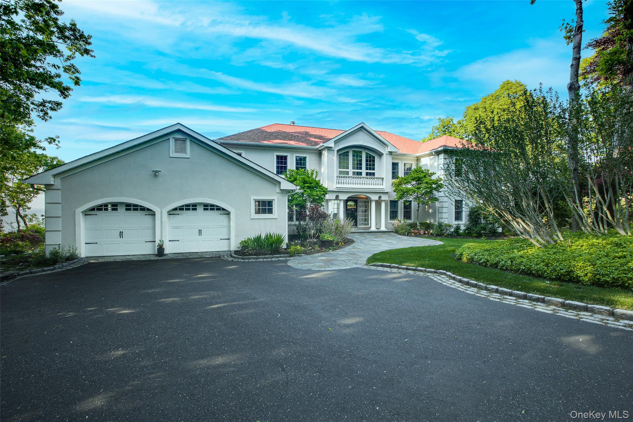 15 Stephens Path Port Jefferson, NY 11777 - Photo 2 of 34 a front view of a house with a yard and garage