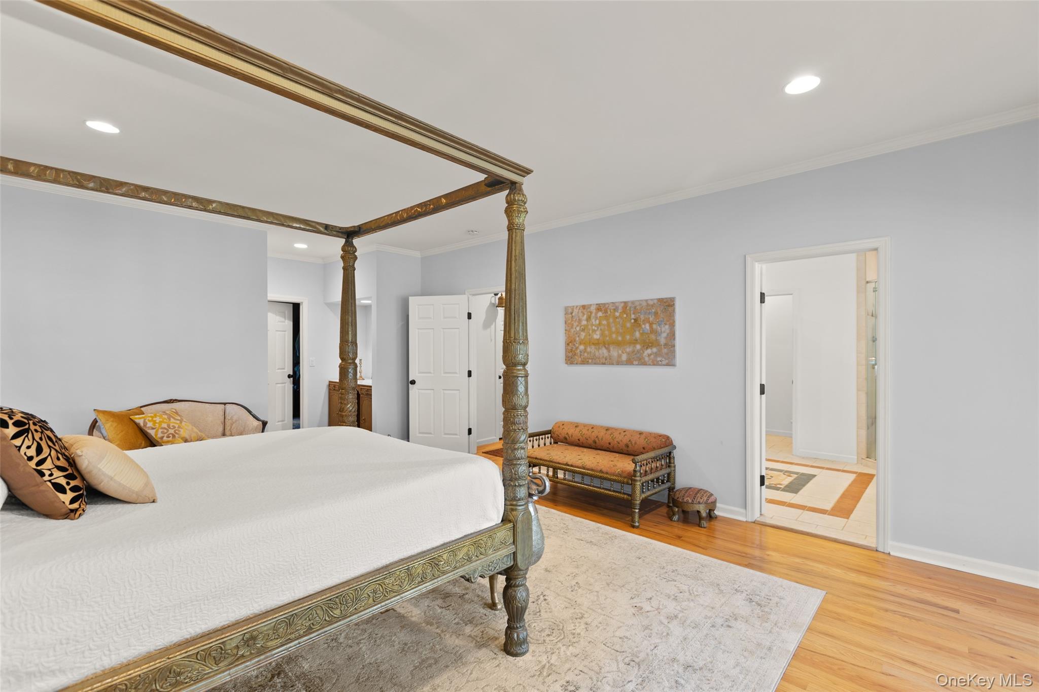 15 Stephens Path Port Jefferson, NY 11777 - Photo 22 of 34 a bedroom with a bed and wooden floor