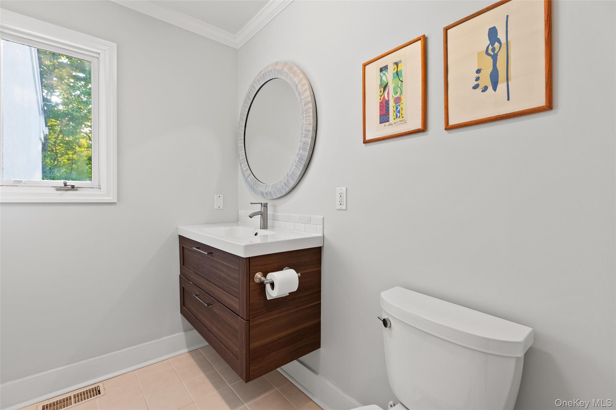 15 Stephens Path Port Jefferson, NY 11777 - Photo 26 of 34 a bathroom with a toilet a sink and a window
