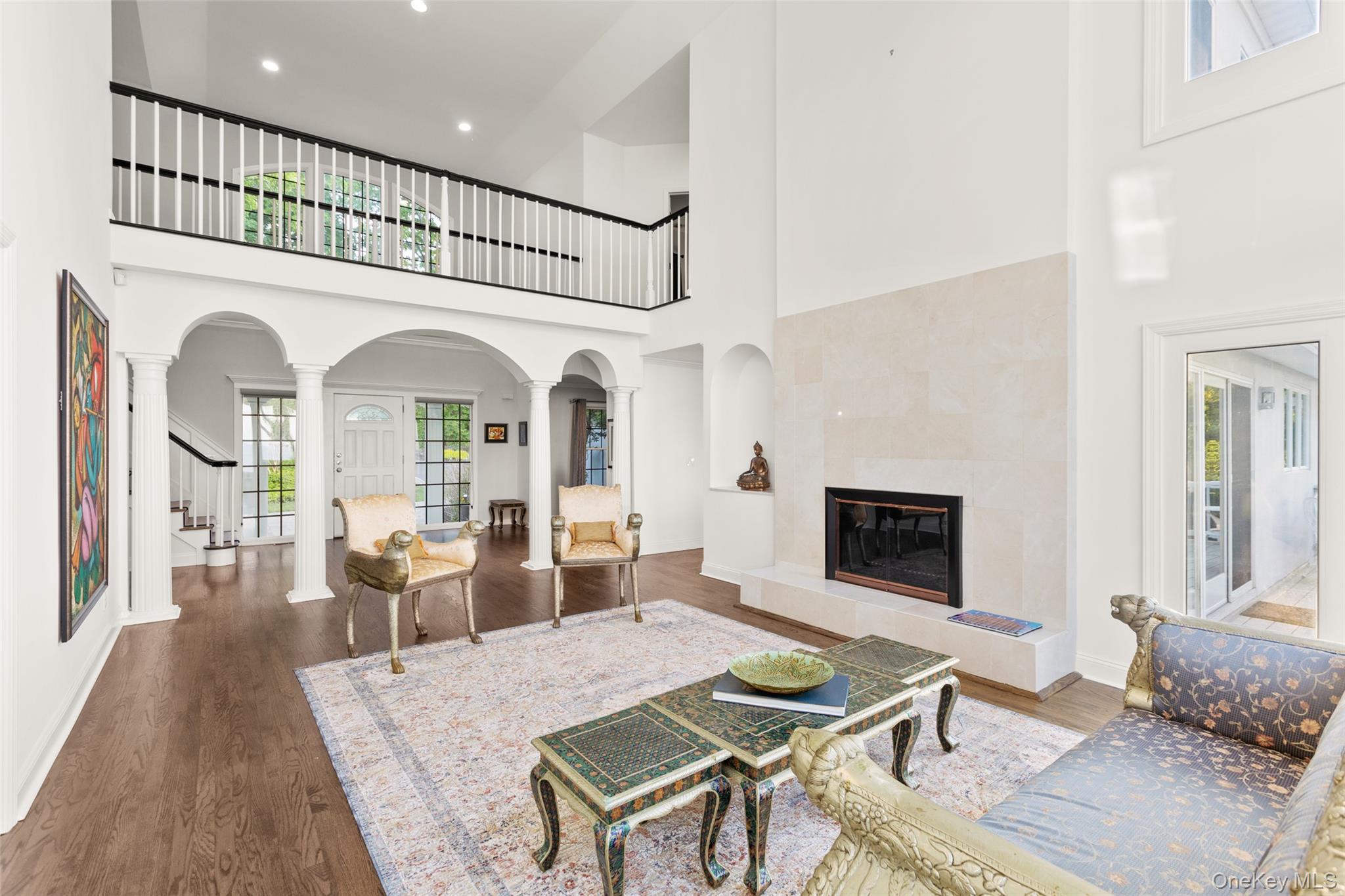 15 Stephens Path Port Jefferson, NY 11777 - Photo 7 of 34 a living room with furniture a fireplace and a table