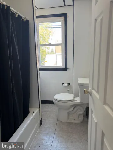 a bathroom with a double vanity sink and mirror