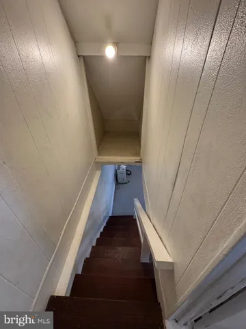 a view of room with air conditioner and windows