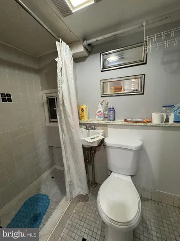 a view of a storage and utility room with windows
