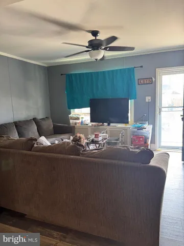 a view of kitchen with refrigerator and window
