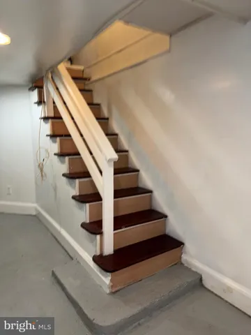 a view of a wooden deck with table and chairs