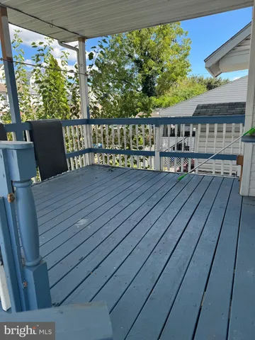 a view of a balcony with furniture