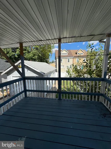 a view of a house with stairs and a yard