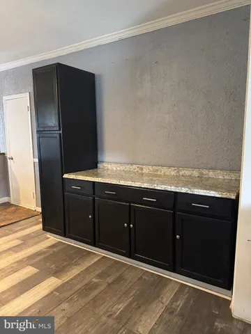 a view of living room with furniture and a flat screen tv