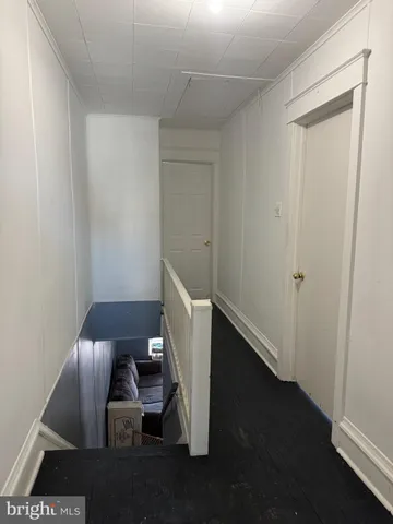 a bathroom with a toilet a sink and a window