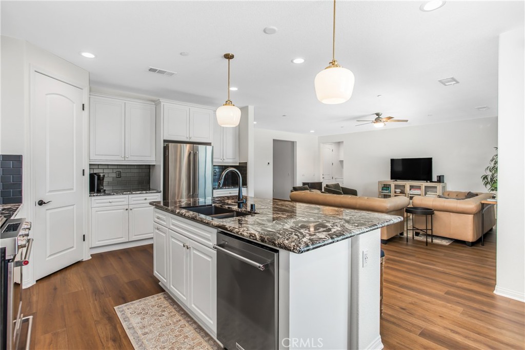 1264 Joshua Tree Road Calimesa, CA 92320 - Photo 7 of 26 open concept kitchen offers, granite counter tops with a stylish backsplash!