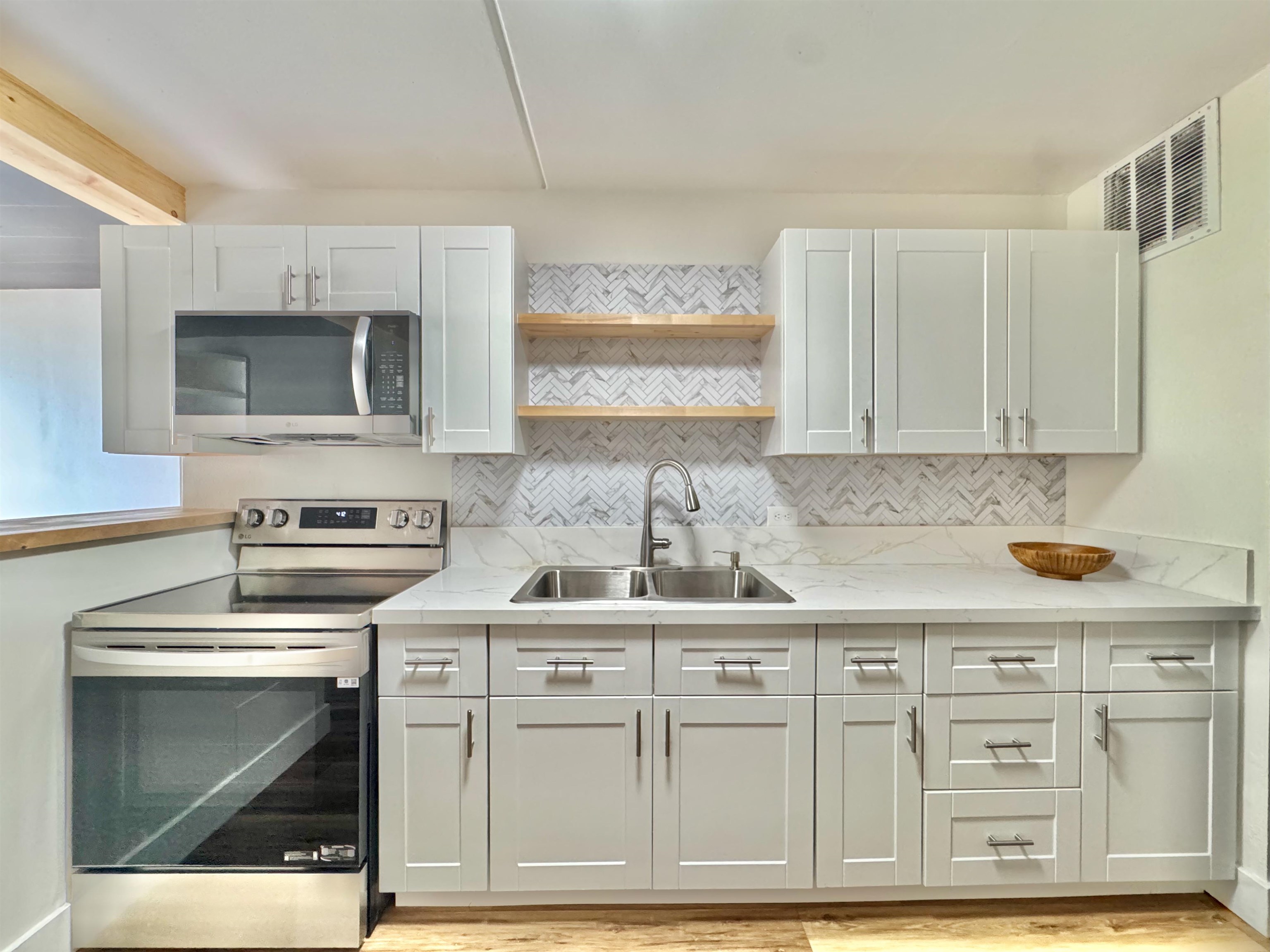 111 Kahului Beach Road, Unit D321 Kahului, HI 96732 - Photo 7 of 22 a kitchen with cabinets appliances and a sink