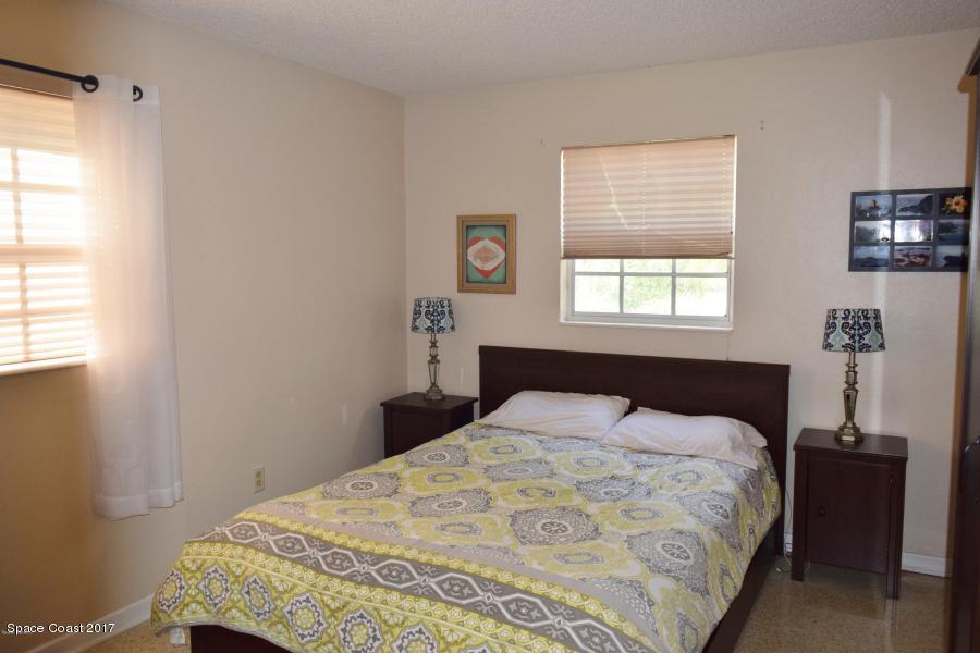 222 Brian Drive Indialantic, FL 32903 - Photo 12 of 14 a bedroom with a bed and a window