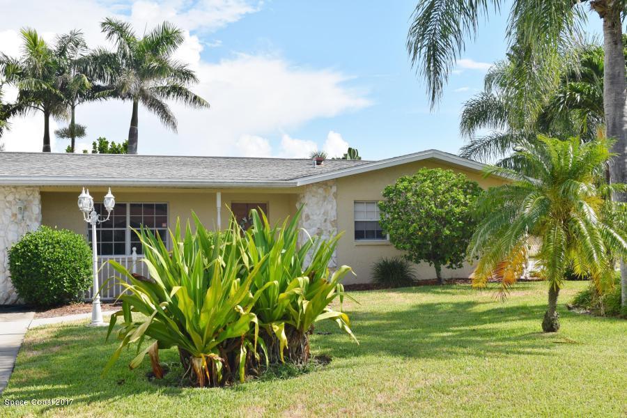 222 Brian Drive Indialantic, FL 32903 - Photo 2 of 14 a front view of a house with garden