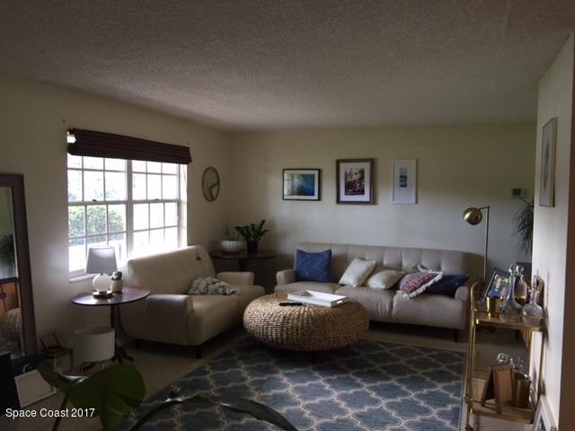 222 Brian Drive Indialantic, FL 32903 - Photo 3 of 14 a living room with furniture and a window