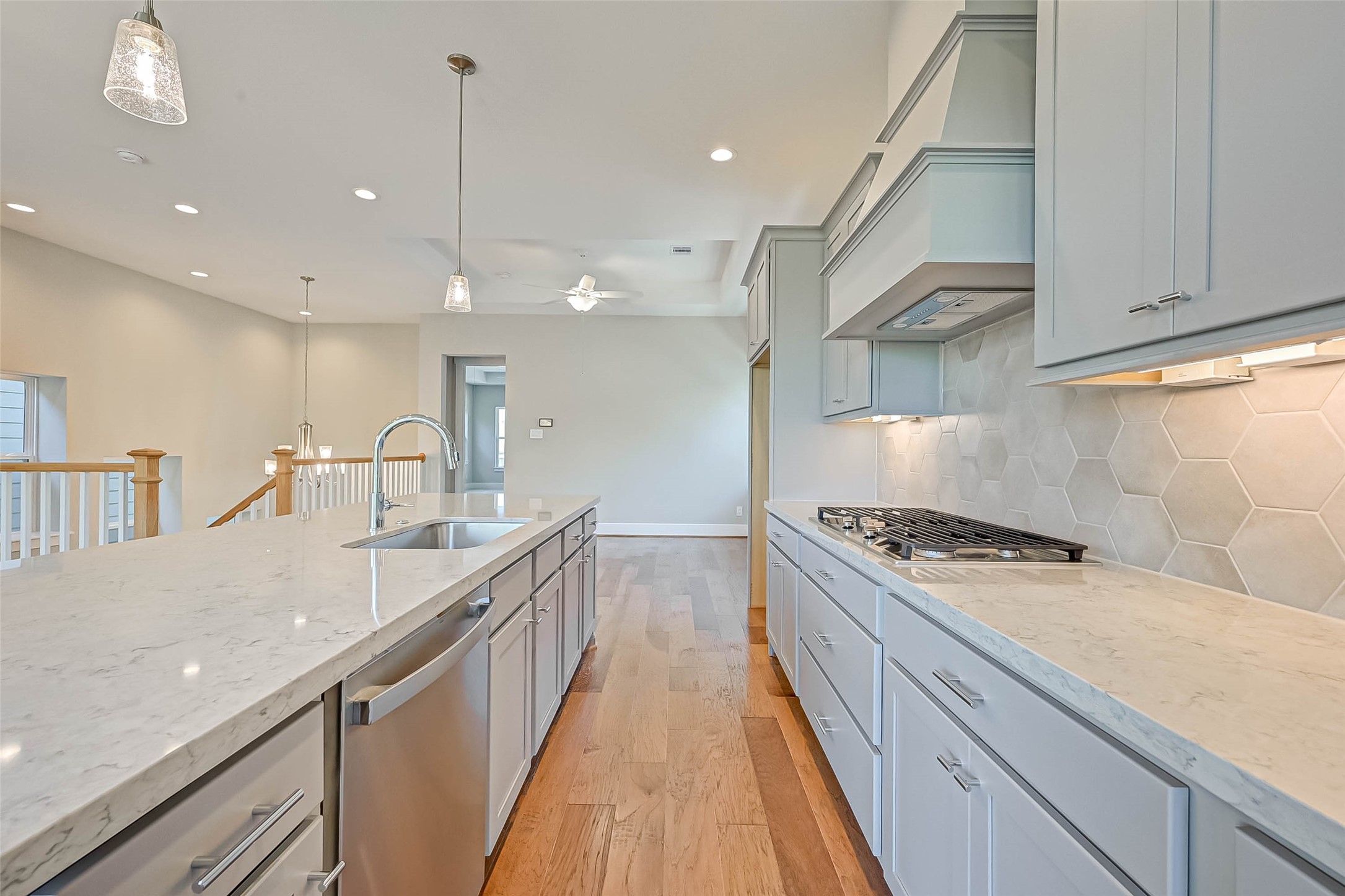 67 Thorpe Lane Spring, TX 77389 - Photo 13 of 27 a kitchen with kitchen island a sink stove and cabinets