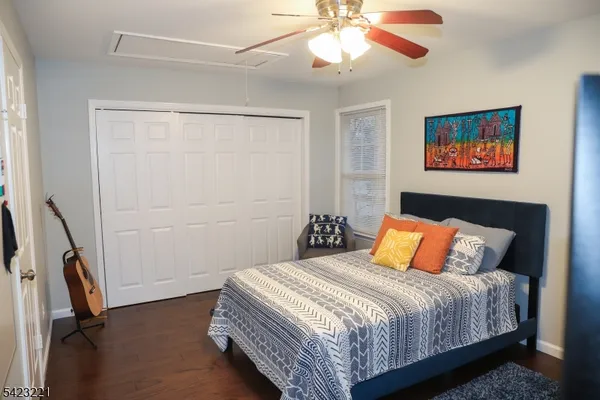 a bedroom with a bed and a dresser