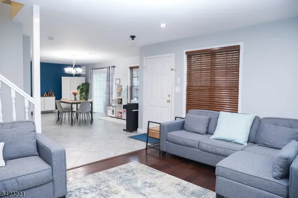 a living room with furniture and a rug