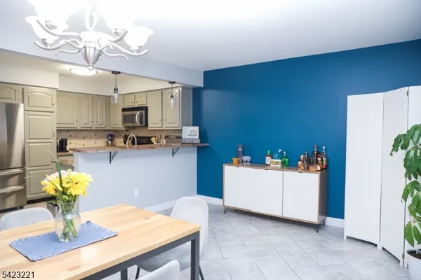 a view of kitchen and kitchen with a sink wooden floors