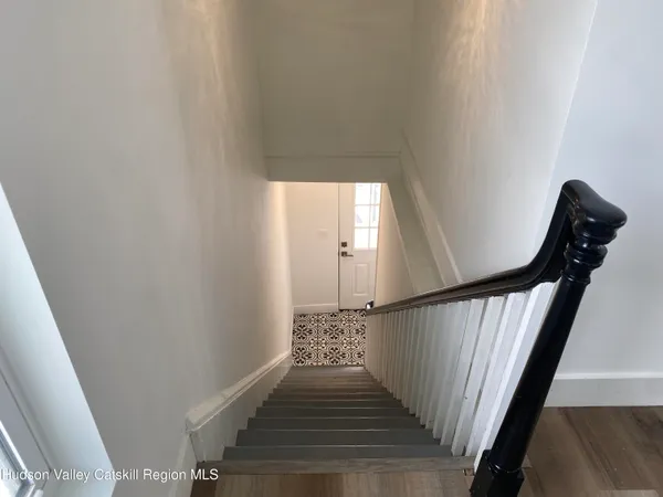 a view of a balcony with wooden floor
