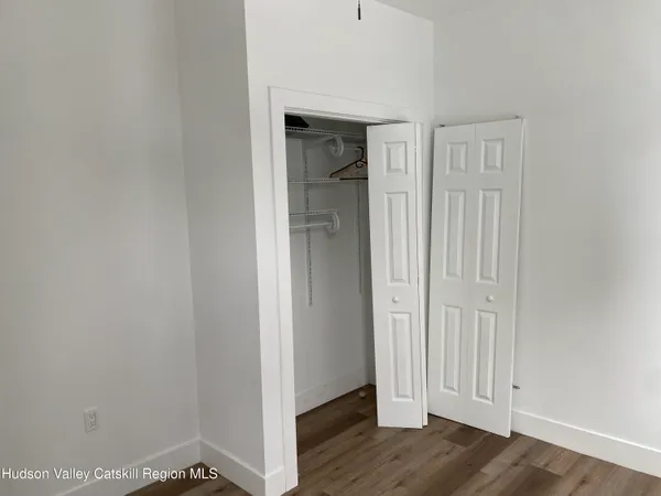 an empty room with wooden floor