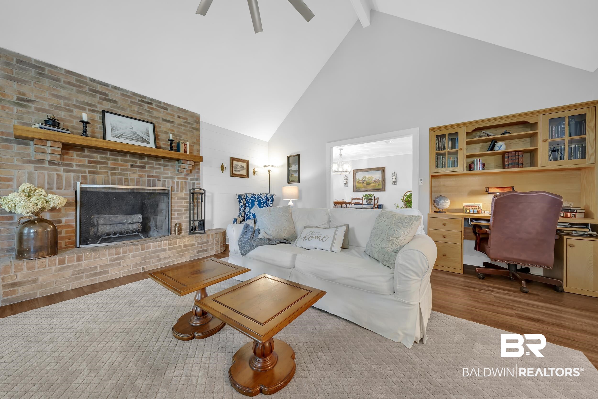 19090 Gunnison Road Fairhope, AL 36532 - Photo 9 of 42 Living room with high vaulted ceiling, light wood-style flooring, beamed ceiling, a fireplace, and ceiling fan