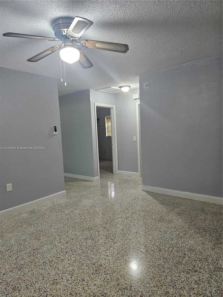 Allapattah Miami, FL 33125 - Photo 4 of 10 a view of an empty room with a fan