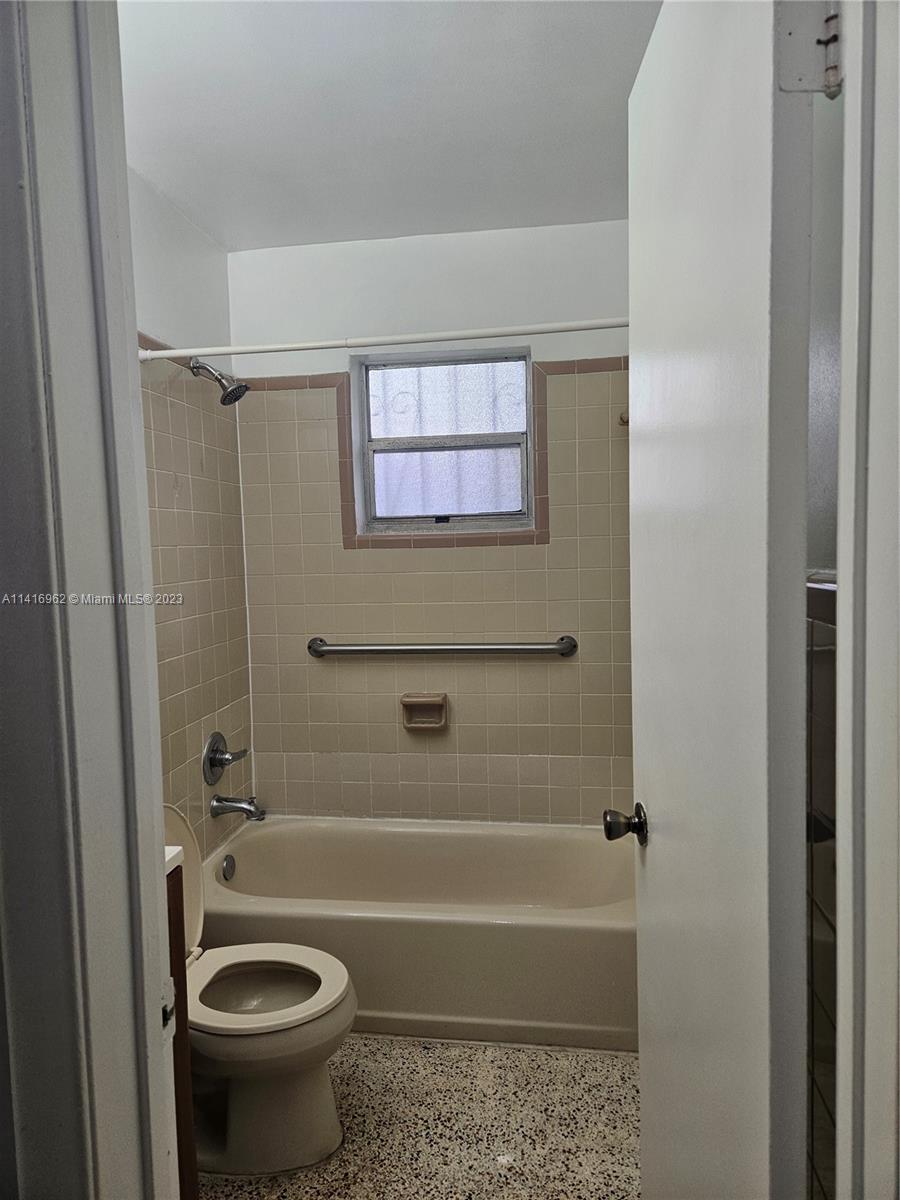 Allapattah Miami, FL 33125 - Photo 8 of 10 a bathroom with a sink a toilet and a bathtub