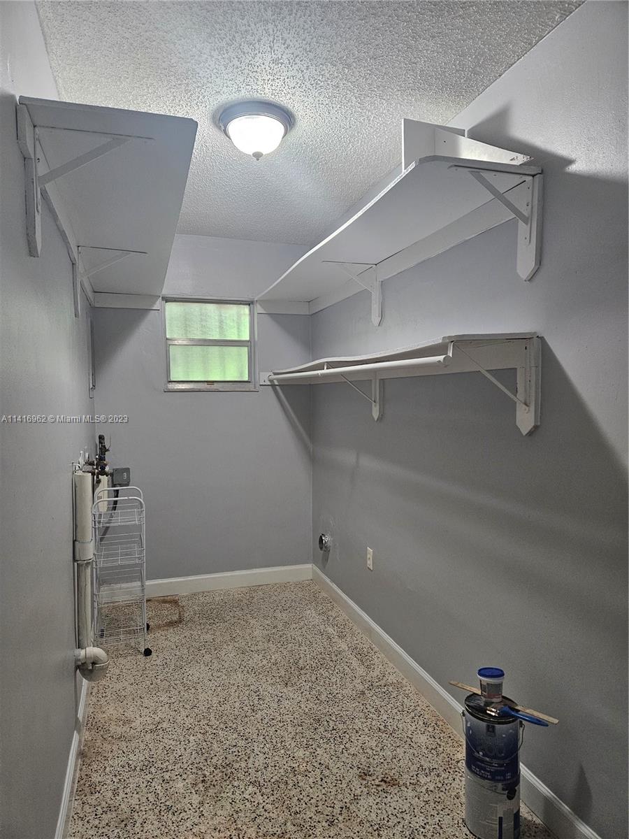 Allapattah Miami, FL 33125 - Photo 9 of 10 a view of a room with racks on the wall