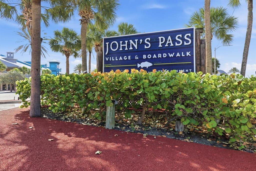 337 Rex Place, Unit A Madeira Beach, FL 33708 - Photo 42 of 48 a sign that is sitting in front of a house