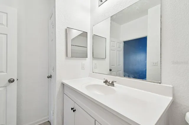 a view of a brick building next to a yard