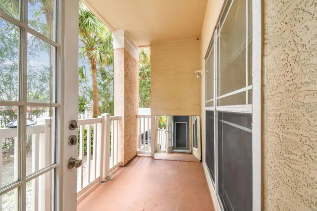 a view of a swimming pool with a lounge chair