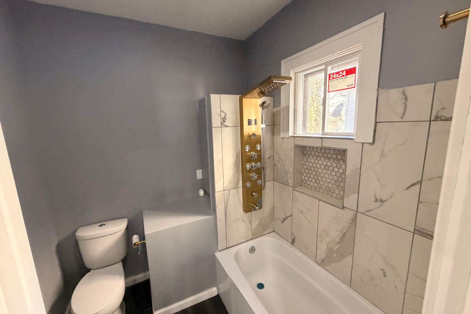 353 South 5th Avenue Kankakee, IL 60901 - Photo 6 of 12 a bathroom with a sink and bathtub with toilet