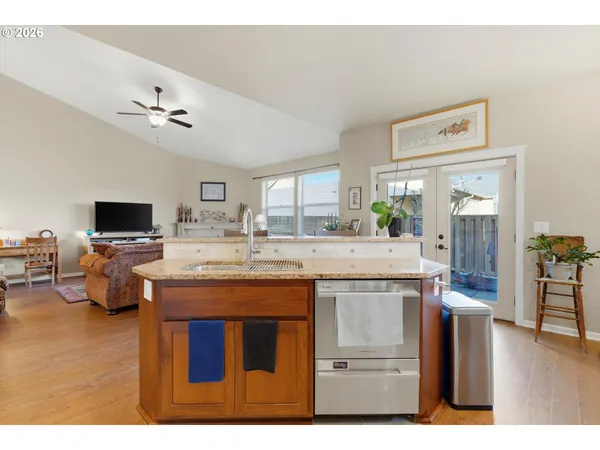 a view of living room with granite countertop furniture and flat screen tv