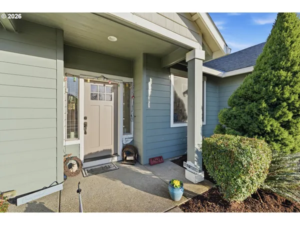 a view of a front door and a yard