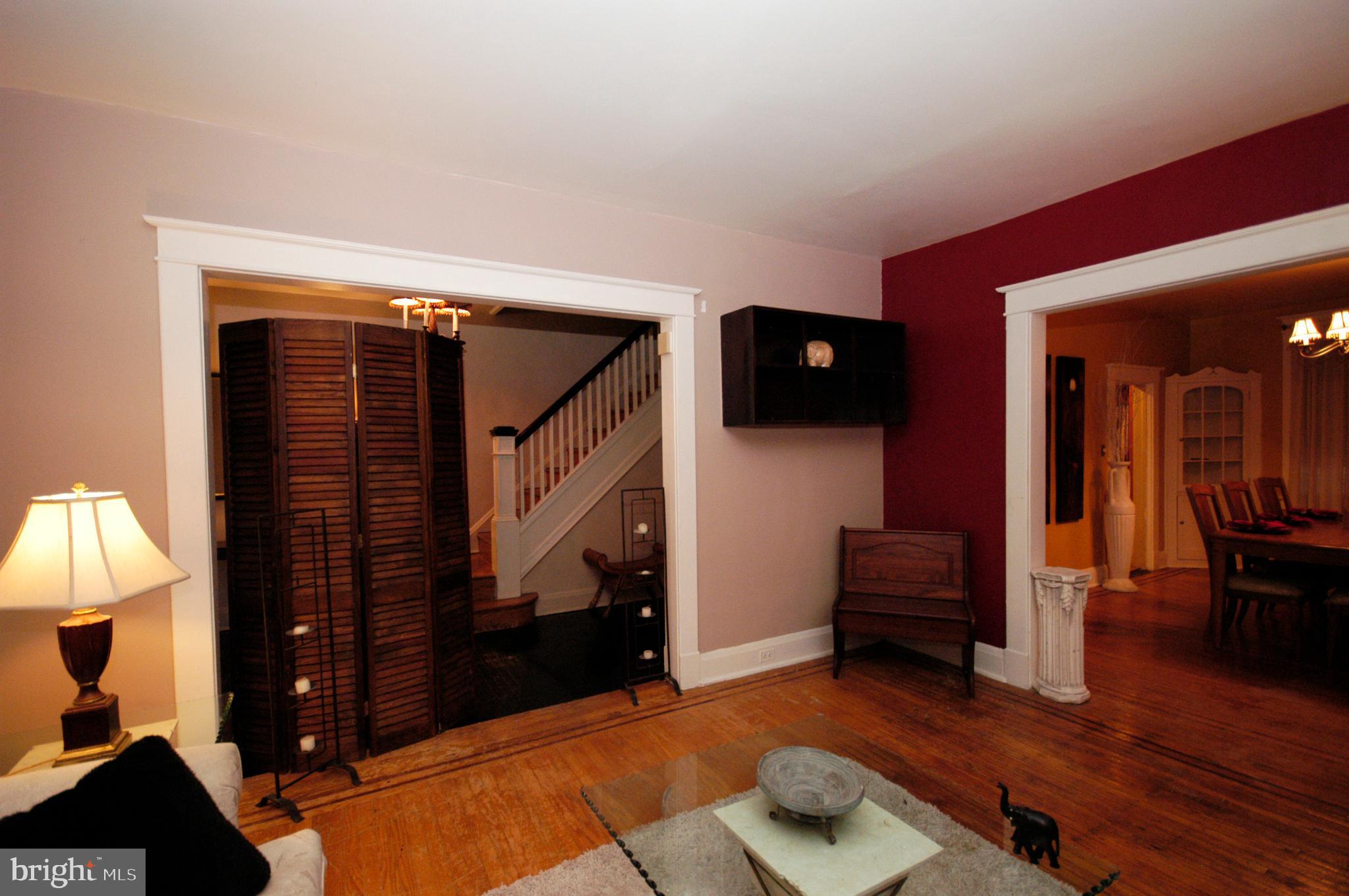 2417 North Pulaski Street Baltimore, MD 21217 - Photo 11 of 26 a living room with furniture and a fireplace
