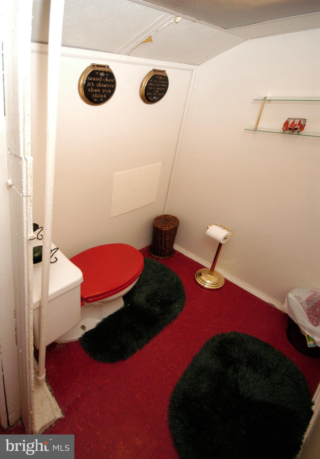 2417 North Pulaski Street Baltimore, MD 21217 - Photo 25 of 26 a bedroom with a bed and a dresser