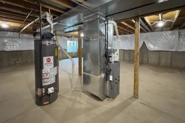 a utility room with refrigerator and washer