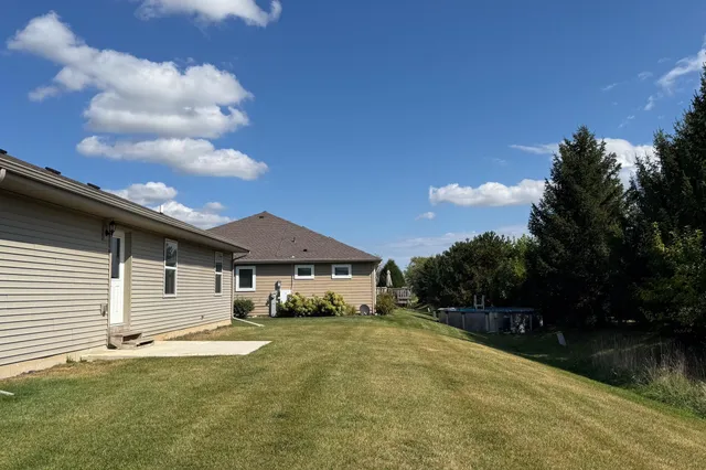 a yellow house with trees in front of it