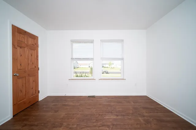 an empty room with windows