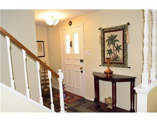 Entry/Foyer. Updated light fixtures and fresh wall colors throughout.