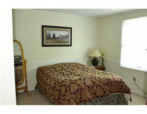 2297 Cramden Road Upper St. Clair, PA 15241 - Photo 15 of 18 Bedroom. Neutral carpets and chair rail accent this bedroom.