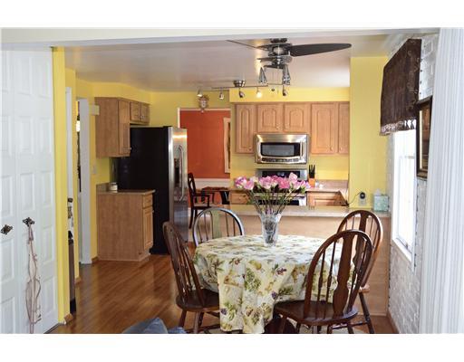 Kitchen. Notice the new fan over the generous table space.