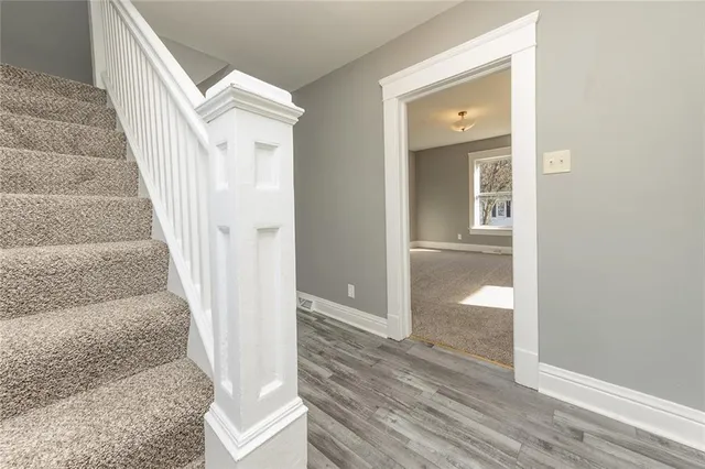 a view of a hallway view with staircase