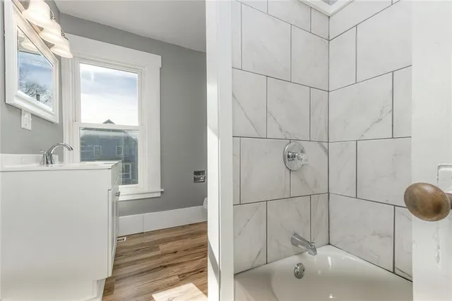 a bathroom with a sink and mirror