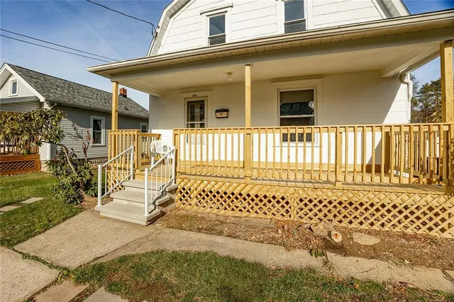 a view of a house with a bench