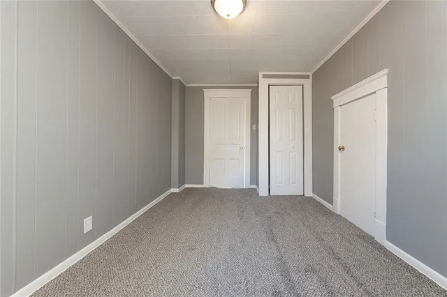 a view of a room with a ceiling fan