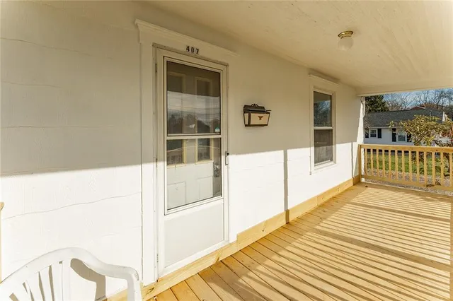 a view of a balcony with wooden floor
