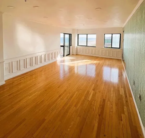 a view of an empty room with windows