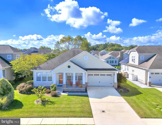 an aerial view of a house with a garden