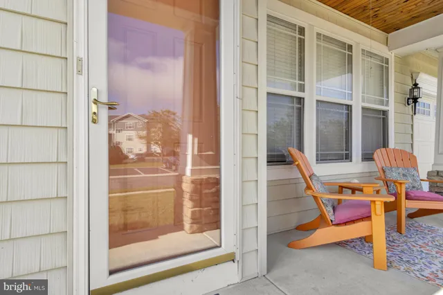 a view of a dining room with furniture wooden floor and chandelier